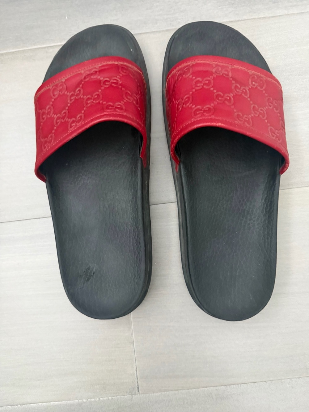 Authentic Gucci GG Supreme embossed rubber slides in red